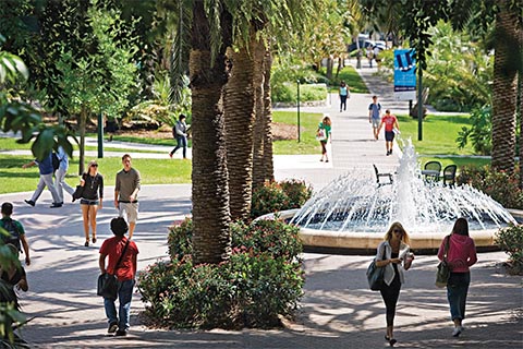 Students walking around the  Merrick fountain