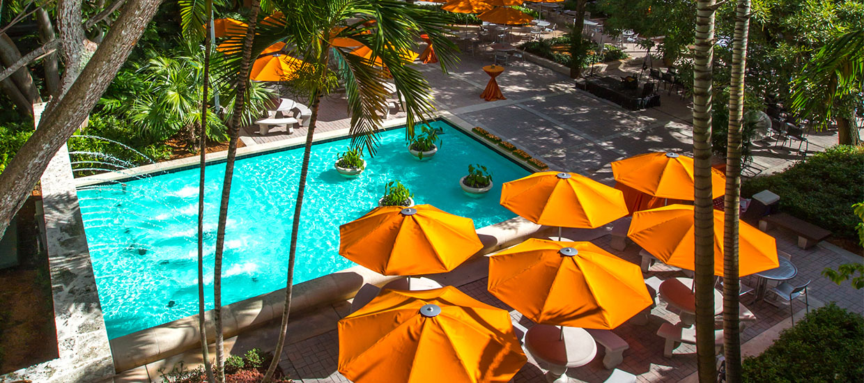 University of Miami Law School courtyard with umbrellas and fountain